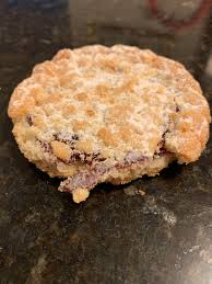 Whether you're making them for a party, santa, or just a cozy night in by the fireplace, there's always a reason to whip up a batch of cookies during the holidays. What Is This Dessert My Mom Brought Them Over But Can T Tell Me Anything Except From Costco Or Bjs About The Size Of Your Palm Blueberry Ish Filling And Delicious I M