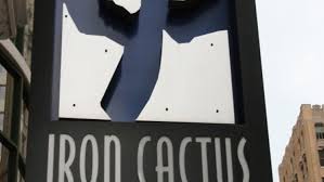 Looking up at the district sign on the iron cactus in downtown dallas, texas. Iron Cactus Downtown Deep Ellum Mexican Tex Mex Bars And Clubs Restaurant Dallas Observer