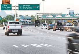 To fulfil its promise to abolish highway tolls, the current administration is working towards eliminating toll collection in stages. Guan Eng Abolish North South Highway Toll Rates Malaysia Malay Mail