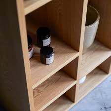 Craftsmen make these unique pieces with dovetailed drawers and no veneers. Tikamoon Eyota Oak High Bookcase