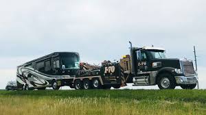 Whether you're hauling a flatbed trailer full of steel or towing the skid steer out. Heavy Truck Towing I 70 Columbia Mid Mo Heavy Towing Service