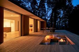 Curved stone walls create both privacy and extra seating. Ten Outdoor Spaces With Warming Fireplaces And Fire Pits