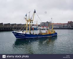 Download This Stock Image Small Fishing Boat Flatfish Trawler Ye 139 Leaving The Port Of Scheveningen The Netherlands Small Fishing Boats Fishing Boats Boat