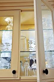 The beautiful cream finish is enhanced by the brushed glaze. Traditional Antique White Kitchen Cabinets 24 Kitchen Design Ideas Org Glass Cabinet Doors Glass Shelves Kitchen Antique Kitchen