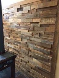 Two window walls let in gorgeous lake views, while barn wood and other reclaimed materials create a relaxed vacation vibe. 15sf Reclaimed Barn Wood Stacked Wall Panels Reclaimed Wood Wall Panels Reclaimed Barn Wood Wall Wood Panel Walls
