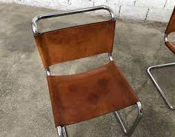 Poul kjaerholm, chaise pk 24, 1965, acier plat chromé, moelle de rotin tressée, cuir inv. Ensemble De 4 Chaises Cuir Fauve Marcel Breuer Modele B33