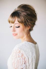 A bun hairstyles is generally associated with the hair being pulled back completely, showing off the forehead. 40 Beautiful Brides With Bangs
