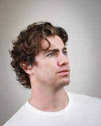 How To Wear The Flow Haircut Mens Haircuts Wavy Hair Wavy Hair Men Long Curly Hair Men
