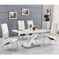 The extension pieces are cleverly hidden inside the table. Axara Extending Small Dining Set In White Gloss 6 White Chairs Furniture In Fashion Small Dining Table Dining Room Small Dining Room Chairs Modern