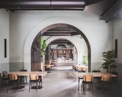 A Garage Turns Into A Restaurant In The Port Area Of Palermo In 2021 Restaurant Sage Green Walls Wooden Panelling
