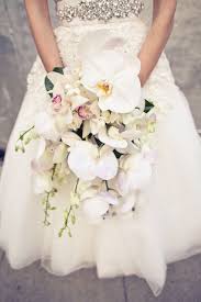 White orchid and peony bouquets. Orchid Bouquets Wedding Bouquet Featuring Cymbidium Orchids Phalaenopsis Orchids Orchid Bouquet Wedding Bridal Bouquet Flowers Wedding