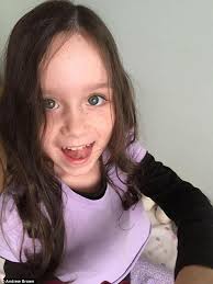 Little girl left is told her tumour is GONE four days before Christmas