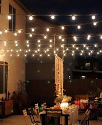 Outdoor Magic How To Decorate With Fairy Lights Outdoor Patio Lights Backyard Lighting Outdoor Dinner