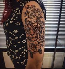12 Best Tiger And Flower Tattoo Designs Petpress Tiger And Flower Tattoo Tattoos For Women Flowers Flower Tattoo