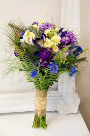 Blue Purple Cream And Soft Yellow Wedding Flowers With Peacock Feathers Http Livingf Bright Wedding Flowers Orange Wedding Flowers Yellow Wedding Flowers