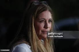 Adria Stone is hugged outside the home of her father, Roger Stone,... News  Photo