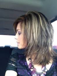 Layers keep hair from being too heavy, which is essential for medium length and long tresses. Shoulder Length Textured Haircut Women Novocom Top