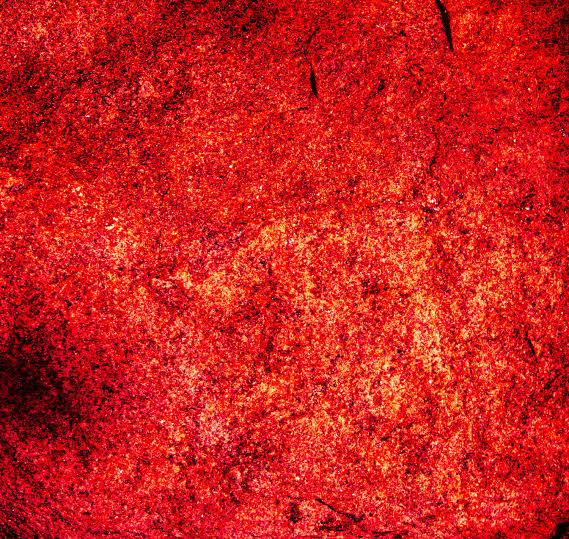 A vibrant red textured surface with rough details - Free Photo on Unsplash