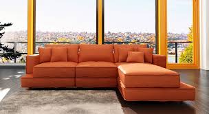 Colorful pillows covering the sofa softens the furniture's rough and rugged good looks. Living Room Ideas Orange Sofa Novocom Top