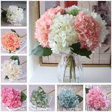 With other blooms, they can add an abundance of texture, effectively amping up the value of the other flowers in the centerpiece. Light Blue Hydrangea Real Like Artificial Silk Hydrangea Etsy Silk Hydrangeas Flower Centerpieces Flower Centerpieces Wedding