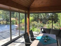 Verglasung Mit Faltsystem Und Schiebeture Aluminium Faltturen Glas Terrassenuberdachung Uberdachung Terrasse Terrassenverglasung