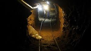 Batteries are stacked next to rails inside a tunnel in this undated photograph provided by mexico's federal police, october 22, 2015. Us Mexico Border Longest Ever Smuggling Tunnel Discovered Bbc News