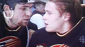 Trevor Linden and teammate Pavel Bure chat.