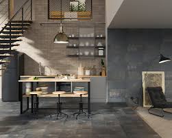 For affordability, look towards carpet tiles and floating floors, while timber flooring and slate tiles are up the higher end. Living Room With A Kitchenette In The Industrial Style Ceramika Paradyz