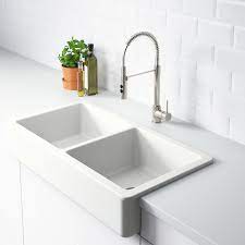 I personally am going to buy a 42 inch (measure by the back edges) corner sink cabinet from home depot put an ikea door on the front so it matches the rest of the kitchen. Havsen Apron Front Double Bowl Sink White Ikea