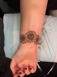 52 Small Sunflower Tattoo Ideas And Images Piercings Models Sunflower Tattoo On Wrist Sunflower Tattoo Small Sunflower Tattoo