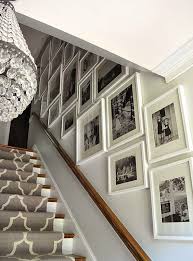 Black And White Gallery Wall Stairs White Frames In Different Sizes But Same Style Stairway Gallery Wall Gallery Wall Staircase Stairway Gallery