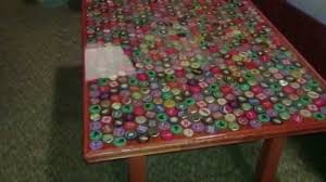 Well, here is a perfect way to make you can make a coffee table with bottle caps with different designs, colors, patterns or whatever you would want. How To Make A Bottle Cap Table Youtube