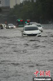 Vehicles are stranded after a heavy downpour in zhengzhou city, central china's henan province on july 20. Vpi1m3mplctlqm