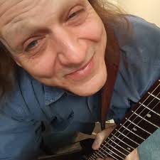 How far can a fretting hand stretch