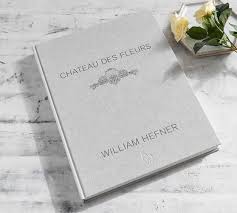 You can create an 8x10 hardback coffee table book with a dust jacket for $30 (40 pages). Chateau Des Fleurs Coffee Table Book Pottery Barn