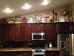 Pick a white or cream as your base, and then perhaps a shade of blue or yellow, which is a great combination for farmhouse kitchens. Kitchen Ideas Decorating Ideas For Above Kitchen Cupboards