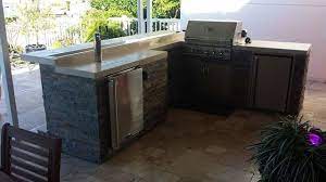 Choose from our selection of outdoor bar centers including portable and stationary options. Outdoor Bbq Bar W Kegerator And Fire Pan On Bar Rustikal Patio Jacksonville Von Arcadia Outdoor Kitchens