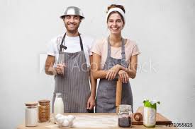 Images, gifs and videos featured seven times a day. Family Couple Cooking At Home Baking Cake Having Happy Expressions Pretty Female With Dirty Face Holding Rolling Pin In Hands Standing Near Her Attractive Husband Who Has Fun Posing With Whisk