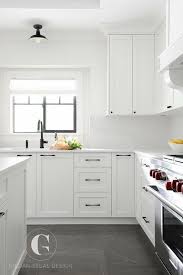 Using white cabinets will generally brighten a room and make a smaller room like more spacious so if you use this in your kitchen, you will have a roomier looking kitchen. Black Hardware Farmhouse Kitchen White Shaker Cabinets Decoomo