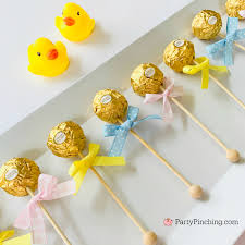 Having a hard time finding a baby gender reveal idea that suits your taste? Ferrero Rocher Baby Rattles Perfect Dessert For Baby Shower Parties