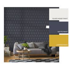 A spacious living room with grey and coral furniture, a white coffee table, a rustic console table, a faux animal skin. Navy And Gold Wallpaper Prism Navy Gold Wallpaper Wall Coverings
