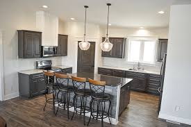 Contrast between the different types of material in the cabinets and countertops. Kitchens Wardcraft Homes Wardcraft Homes