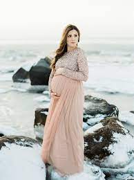 This maternity long sleeve shirt pairs perfectly with all of your jeans or leggings, and is practical for any activity. What To Wear For A Winter Maternity Shoot Lauren Mcbride