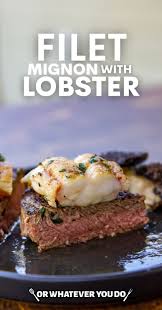 Well done style t bone steak and lobster plate on table beside roasted vegetables side dish and glass of water. Blackstone Filet Mignon With Lobster Or Whatever You Do