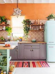 Strong color aside, this kitchen also has a great boho look thanks to other elements, like wood countertops, the cute collection of colorful plates, and the great hanging art. 10 Best Bohemian Kitchen Decor Ideas