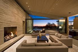 Building with rammed earth history and background advantages of rammed earth in case there were any small holes in the walls, they can be filled by hand from the rammed earth house. Rammed Earth House Brown Red Brilliant Green Design Rammed Earth Homes Earth Homes Luxury Living Room Design
