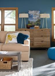 The orange shelf at the foot of the bed brightens up this otherwise neutral room. Color And Wood Tone Choose Colors That Go Together Better Homes Gardens Living Room Colors Room Colors Room Paint Colors