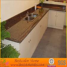 The surface of this stone is easy to maintain and thus perfect for high traffic regions like kitchen and bathrooms. Tropical Brown Granite Kitchen Countertops Stone Uk Style Work Tops For Kitchen From China Stonecontact Com