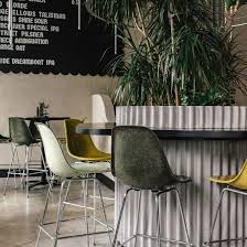 Green And Yellow Eames Chairs Fill Tacofino Ocho Restaurant In Vancouver Interior Decorating Interior Design In 2020 Eames Chairs Home Decor Interior Design