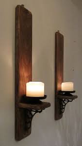 ﻿enjoy a nice variety of primitive candle holders! Pair Of Rustic Reclaimed Wood Wall Sconce Candle Holders With Beautiful Cast Iron Bracket Decoration Candle Wall Sconces Rustic Reclaimed Wood Candle Holder Wall Sconce